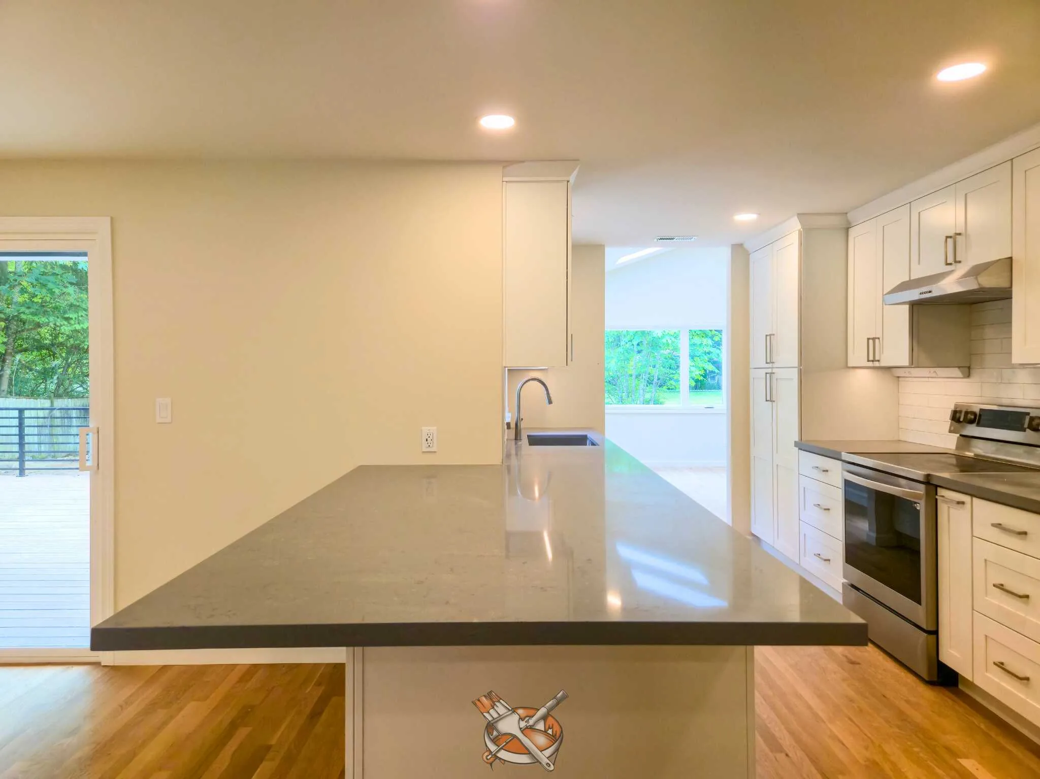 Warm-white cabinets refinished by Hedlund Painting in a Kirkland kitchen remodel