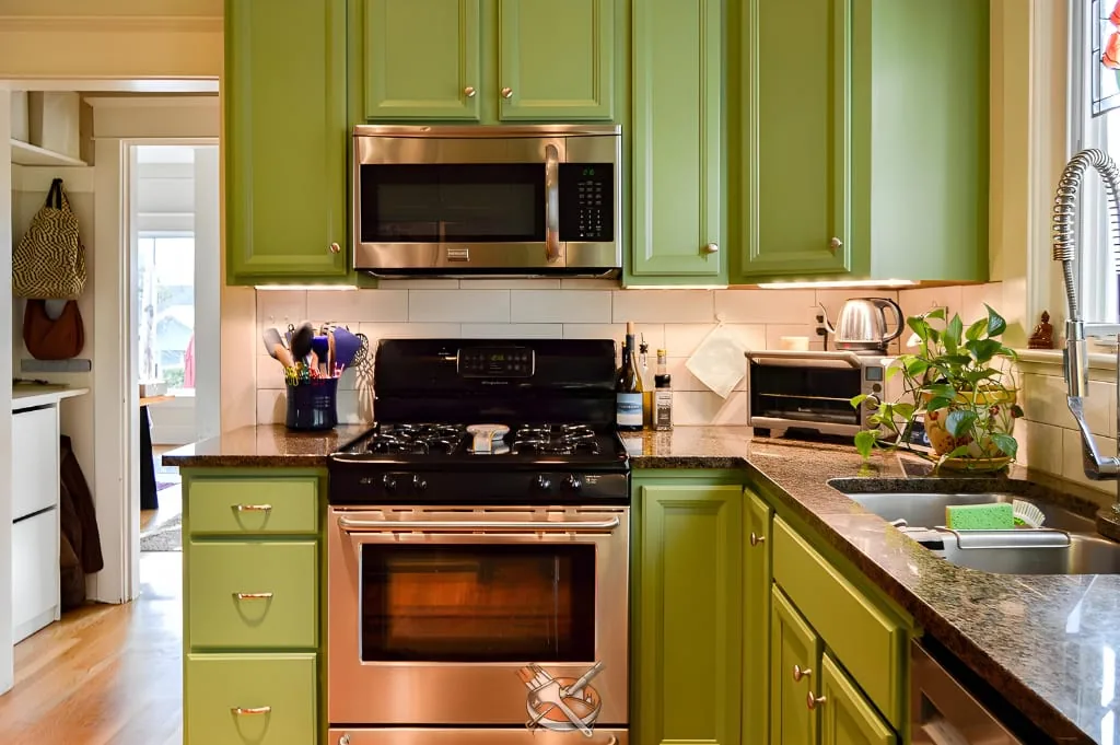 Factory-smooth refinished kitchen cabinets by Hedlund Painting in the Seattle area